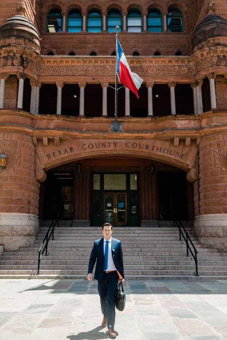 Attorney on the steps of the Bexar County Courthouse